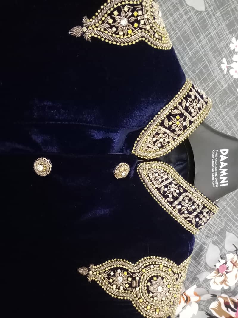 Branded Velvet Blue sherwani with heavy work

                                                            alt=
