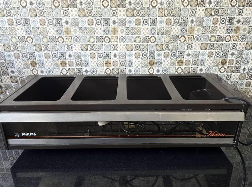 Philips Original Electric Hostess with 4 glass dishes and steel lids.

                                                            alt=