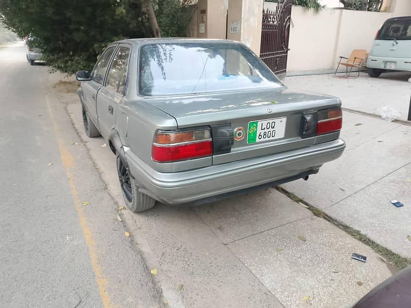 Corolla 88 London model. Mint condition. Urgent sale. DHA.  Only call

                                                            alt=