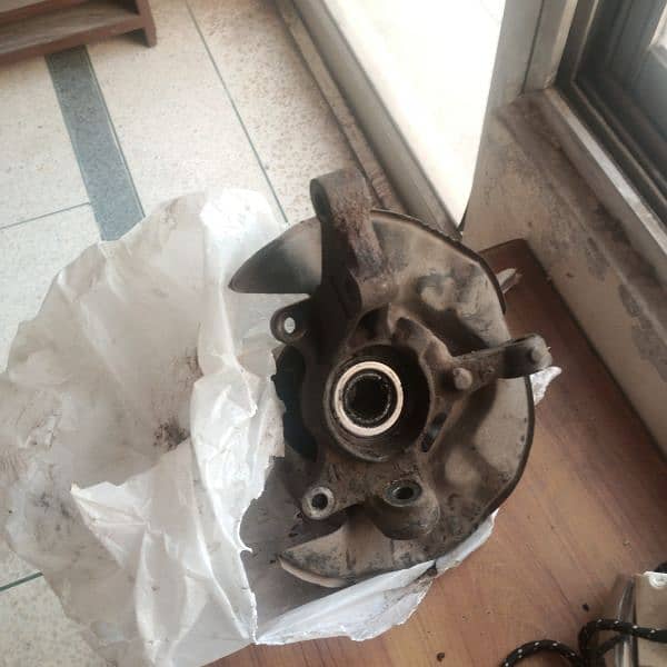 Corolla XLi GLi steering knuckle and wheel bearing Hub

                                                            alt=