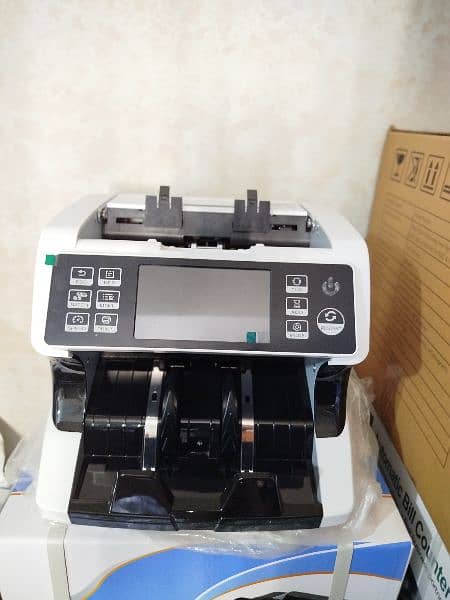 Cash currency counting machine, fake note detection,Branded cash count

                                                            alt=