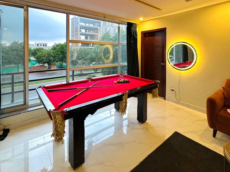 Luxury Indoor Snooker & Billiards Lounge with Scenic View

                                                            alt=