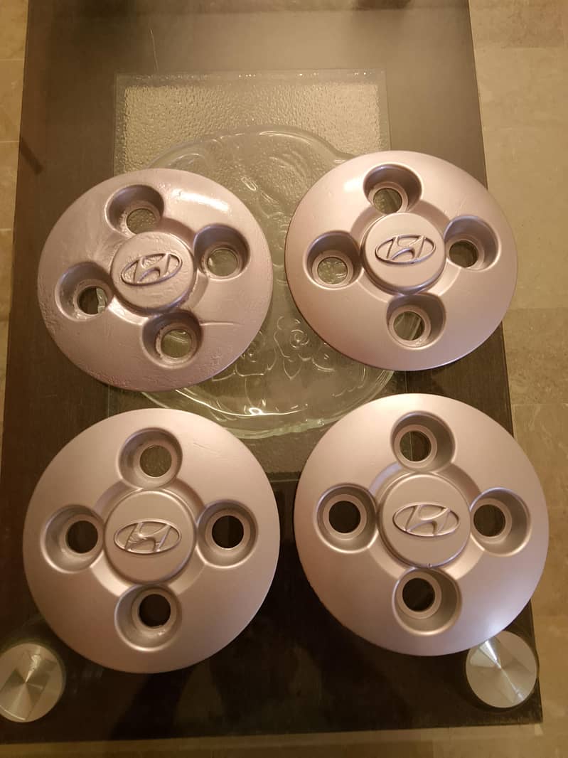 Santro Geniune wheel caps

                                                            alt=