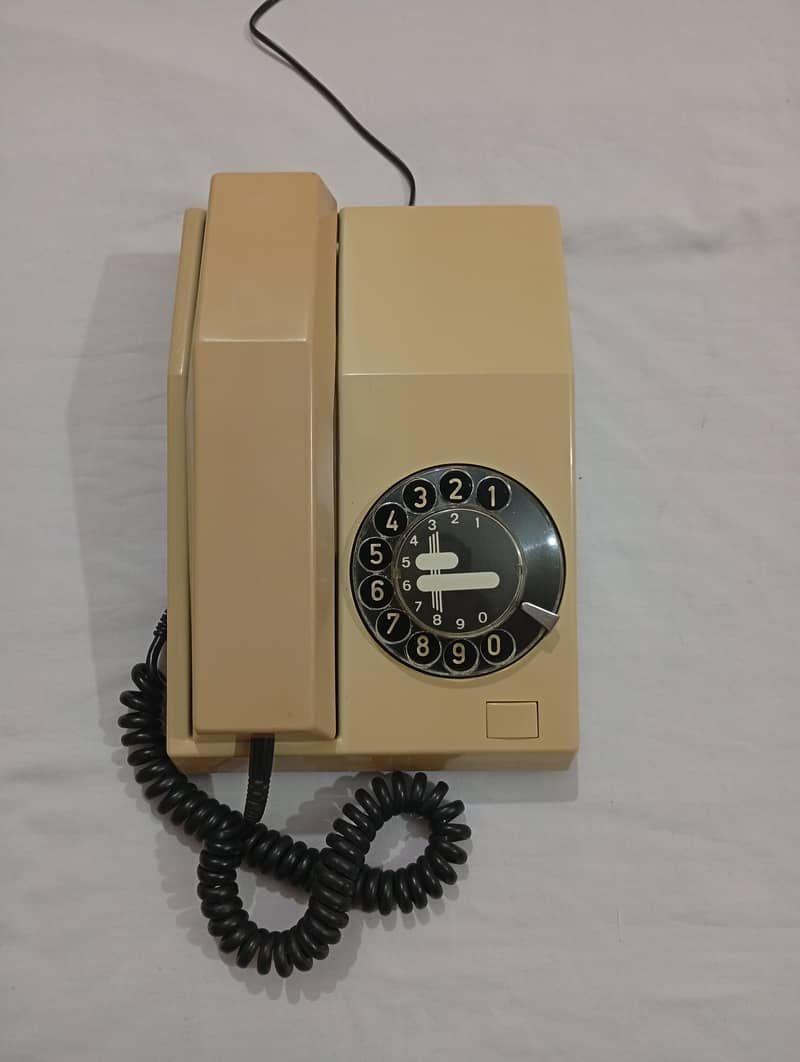 Antique classic vintage rotary old telephone set

                                                            alt=