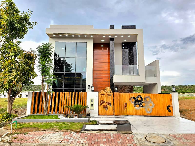 Designer House With Spacious Back Lawn At Height Location In Bahria Overseas

                                                            alt=