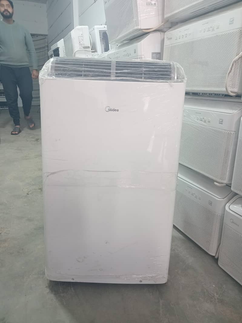 1 ton portable ac /dc inverter / used ac / lot used ac/ midea ac

                                                            alt=