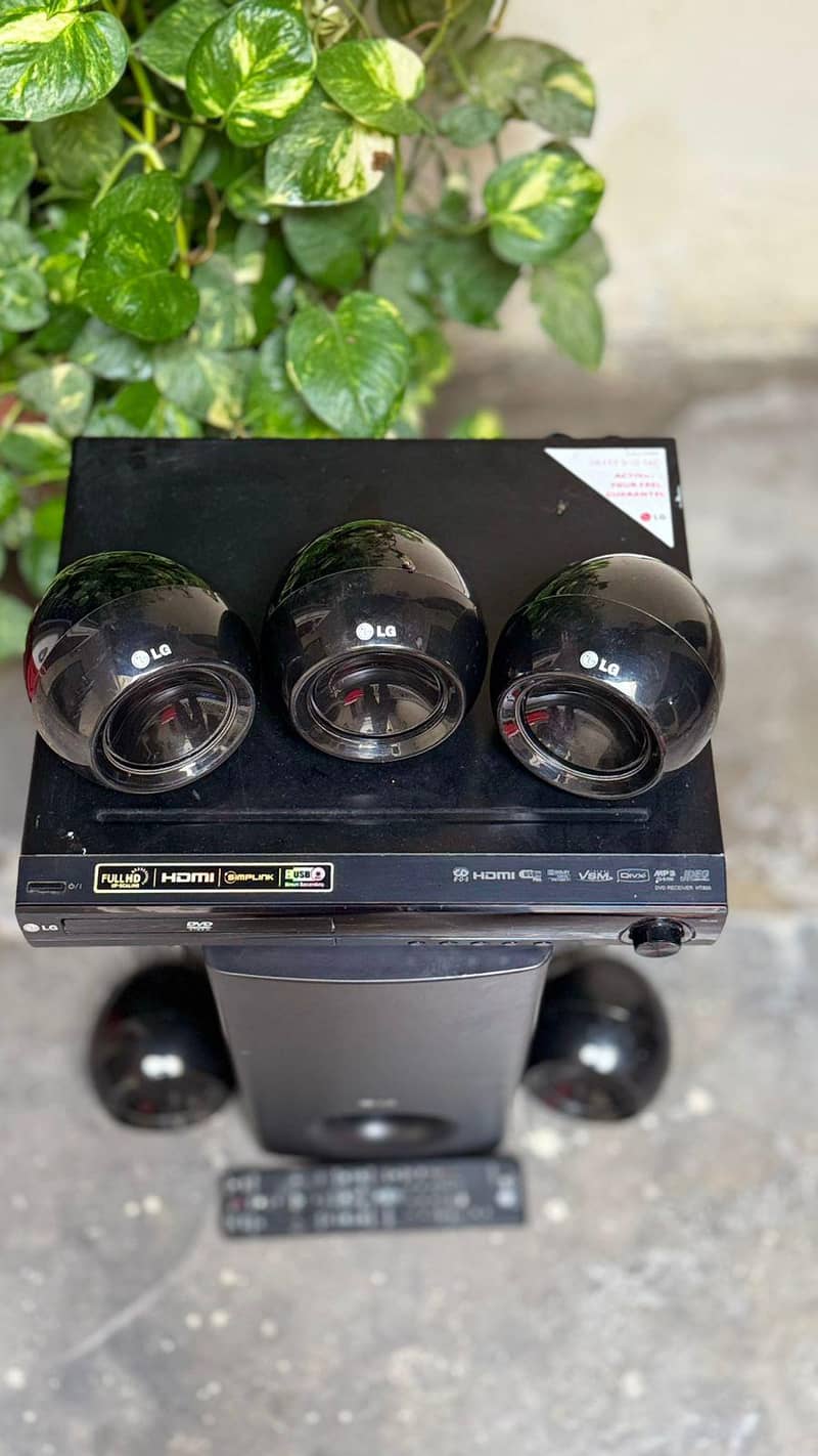 LG 300 Watts 5.1 Channel DVD Home Cinema System (Model No. HT304SU)

                                                            alt=