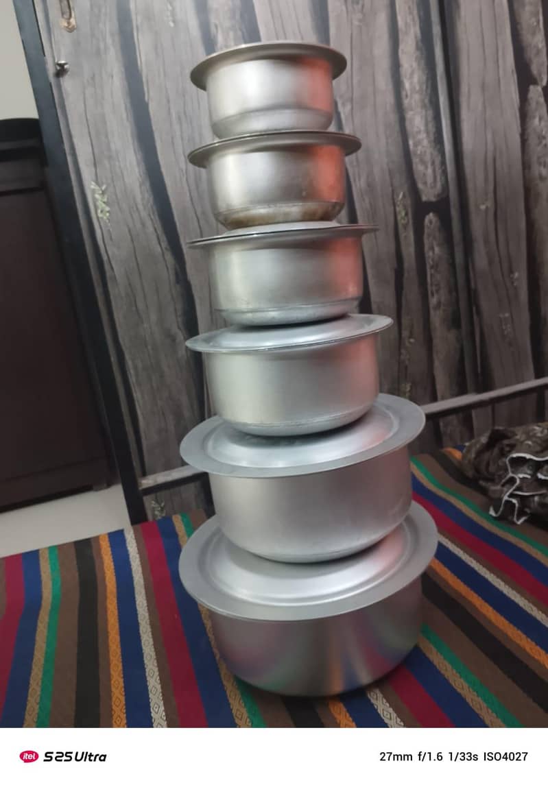 almost new, set of 6 silver pots with large Thali and spoon stand

                                                            alt=